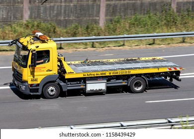 WIEHL, GERMANY - JULY 7, 2018: ADAC flatbed recovery vehicle on motorway. German ADAC it is the largest automobile club in Europe.
