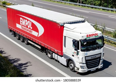 WIEHL, GERMANY - JUNE 26, 2020: EMPOL DAF XF truck with curtainside trailer on motorway.