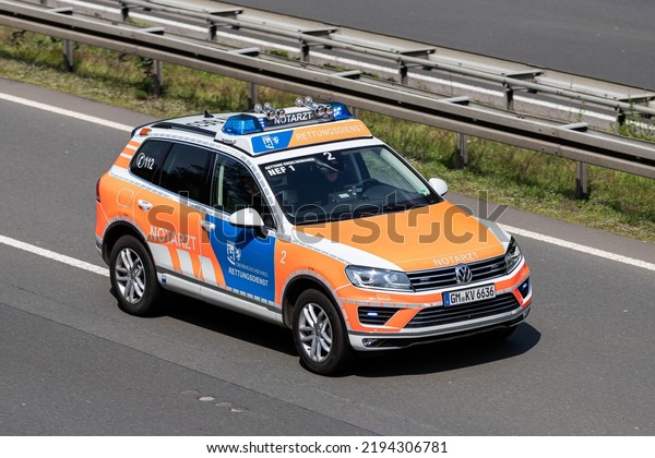 WIEHL, GERMANY - MAY 3, 2022: German emergency\
physician car of the Oberberg distict with active blue emergency\
lighting on motorway