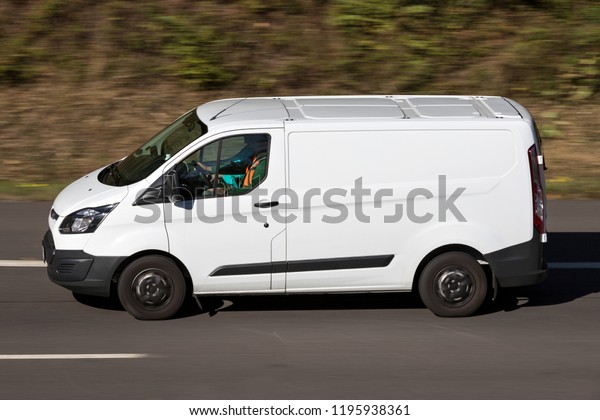 WIEHL, GERMANY - September 29, 2018: Ford\
Transit on motorway. The Ford Transit is a range of light\
commercial vehicles produced by Ford since\
1965.