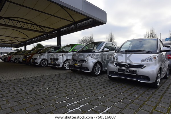 WIESBADEN,GERMANY-JANUARY\
26,2017: SMART cars and\
store.