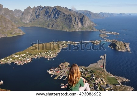 wiev to the Reine with girl, Lofoten islands, Norway