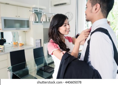 Wife Helping Her Man Going To Office For Work Binding His Tie For Nice Attire