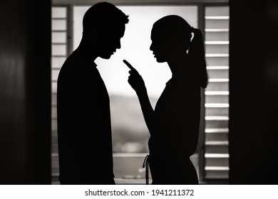 Wife at home nagging verbally abusing her husband. Marriage, relationship problems and divorce concept.  - Shutterstock ID 1941211372