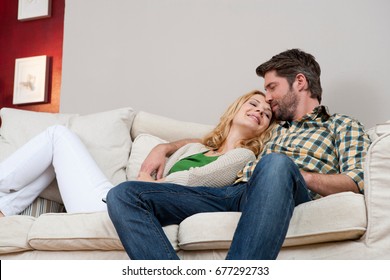 Wife And Husband On Couch