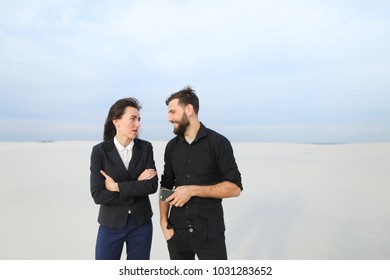 wife and husband using tablet, married couple stop in secluded place after work. Fair-haired female and bearded male searching for resorts planning summer vacation laughing. Concept of innovat