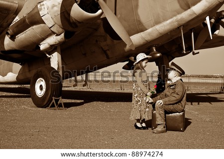 Wife saying good bye to pilot husband leaving for war