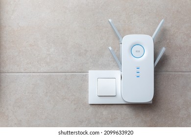 Wifi Extender in Power Outlet - Shutterstock ID 2099633920