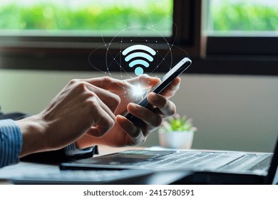 Wifi internet access concept, Business people connect WiFi technology. connect instantly via smartphone and high-speed hotspot. Fast internet wifi hotspot sharing. Working with various applications - Powered by Shutterstock