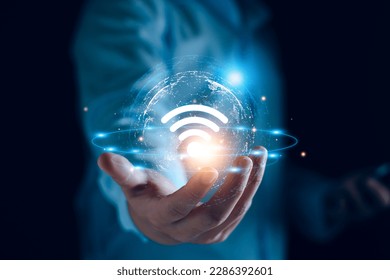 Wifi internet access concept. man using smartphone connect communication, social network, business contact, online shopping via internet wifi hotspot high speed. Fast internet wifi hotspot sharing.  - Powered by Shutterstock