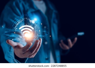 Wifi internet access concept. man using smartphone connect communication, social network, business contact, online shopping via internet wifi hotspot high speed. Fast internet wifi hotspot sharing.  - Powered by Shutterstock