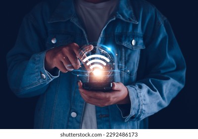 Wifi internet access concept. man using smartphone connect communication, social network, business contact, online shopping via internet wifi hotspot high speed. Fast internet wifi hotspot sharing.  - Powered by Shutterstock