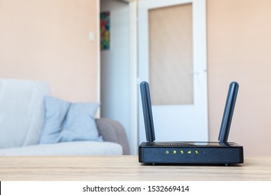 Wifi Modem On Table In Living Room. Home Internet Connection.