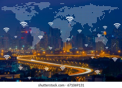 Wifi network connection concept with world global cartography globalizationon aerial view of cityscape business district at twilight.