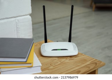 Wi-Fi Router On Wooden Table In Room