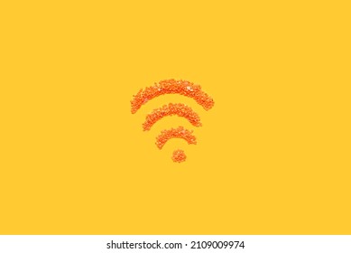 WiFi Symbol Made From Decorative Small Stones On Orange Background