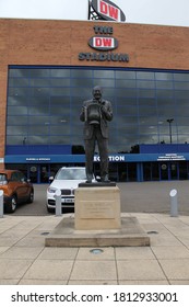 Wigan, England, September 2020: Exterior View Of The Wigan Football Club Entrance With Statue Of Dave Whelan Professional Footballer