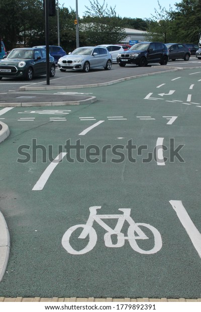 Wigan, Manchester, UK, 20/07/2020: Bike\
lane markings on a UK main road, vertical\
format