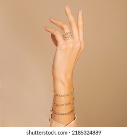 wighte Diamond Tennis Bracelet and Diamond Ring Wear in my sister hand with Light brown background  - Shutterstock ID 2185324889
