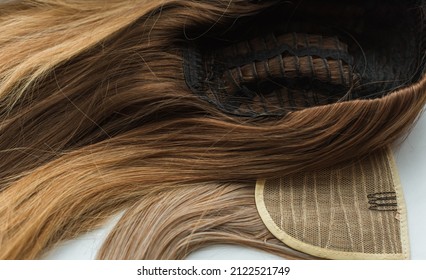 Wigs, natural and synthetic hair. Women's beauty concept. Close up photo of wig, hair for ladies - Shutterstock ID 2122521749