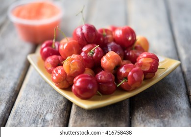 Wild Acerola Cherries On Wood