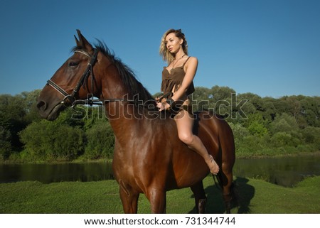 Wild amazon girl on horseback. Fantasy consept