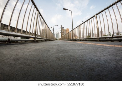 Wild Angle View, Long Walkway With Yellow Line In Urban City, Perspective And Vanishing Point