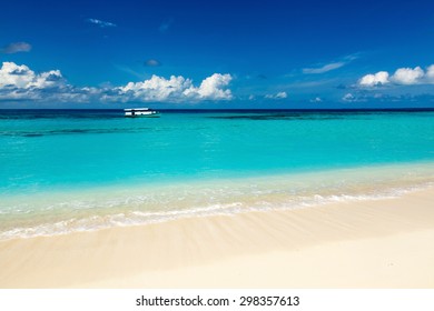 wild beach with white sand and turquoise waters of the Caribbean on the Maldivian Bahamas Hawaii