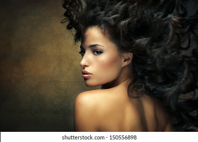 wild beautiful black hair woman shot with hair in motion