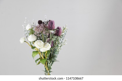 Wild And Beautiful Flower Bouquet On Light Background.