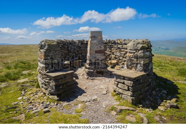 Wild Boar\
Fell is a mountain in the Yorkshire Dales National Park, on the\
eastern edge of Cumbria, England. At 2,323 feet, it is either the\
4th-highest fell in the Yorkshire\
Dales