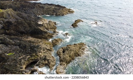 Wild Coast Of The Atlantic Ocean. Small Ripples And Sun Glare On The Surface Of The Water. Seaside Landscape On A Sunny Day. Aerial Photo. Drone Point Of View.