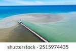 Wild currents on Lake Michigan in Ludington, Michigan mix with water flowing out of the Pere Marquette River creating an interesting pattern around the Ludington North Breakwater Light.