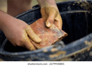 wild earthen clay Potter at work. Workshop place
 - Shutterstock ID 2279930801