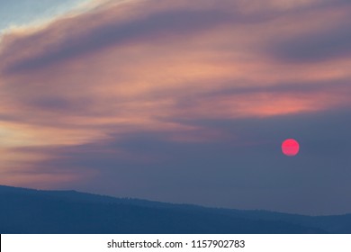 Wild Fire Smoke Sunset with Red Sun - Powered by Shutterstock