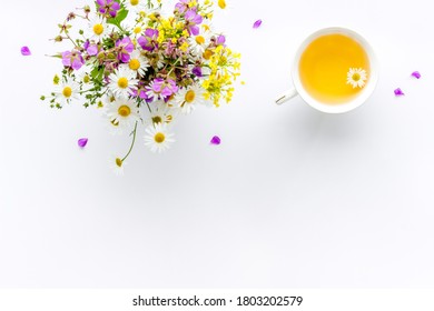 Wild Flowers Bouquet With Cup Tea On A Table, Top View