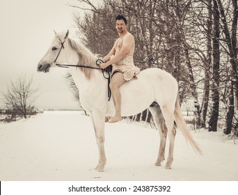 Wild Man On Horseback At Winter Day