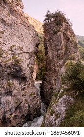 A Wild Mountain River Squeezing Between Two Craggy Rocks In A Gorge