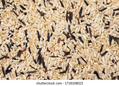 Wild Raw Rice Close Up. Texture Raw Grits. Background Of Food Carbohydrates.