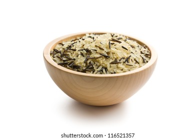 wild rice in wooden bowl on white background