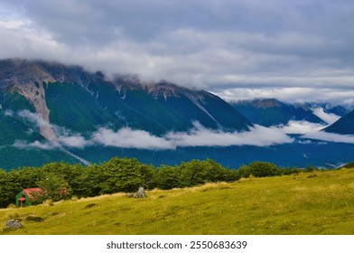 The wild Saint Arnaud Range, seen from the Bushline Hut on Mount Robert, Nelson Lakes National Park, South Island, New Zealand, on a cloudy day, mist hanging in the valley
 - Powered by Shutterstock