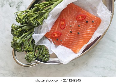 Wild Salmon Fillet With Raw Broccoli On  Marble Table. Flat Layot. Copy Space