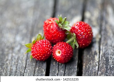 Wild Strawberries On Wooden Table