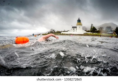 Wild Swim No Wetsuit In Sea Heading To Lighthouse With Tow Float