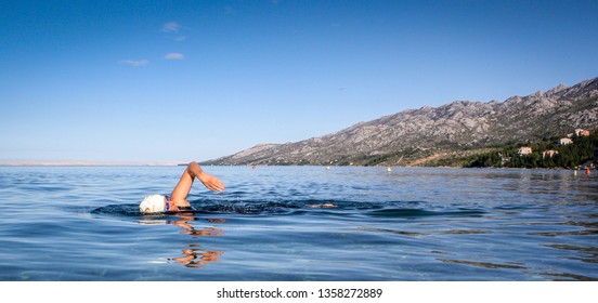 Wild Swim Woman In Sleeveless Wetsuit In Warm Water