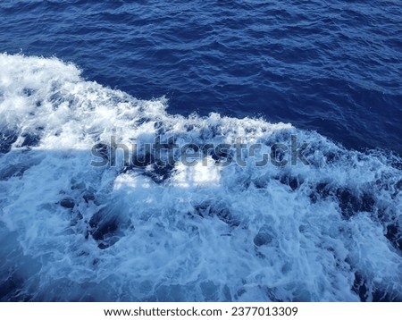 Similar – Aerial view of small boat in sea, copyspace for text