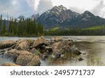 Wilderness lake in Jasper National Park, Pyramid Lake in panorama view. Taken in the summertime with stunning pine, spruce forest surrounding wilderness