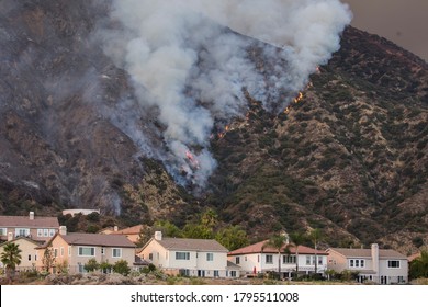 A Wildfire Burns The Hillside Behind Homes On Wednesday, Aug. 12, 2020, Azusa, California