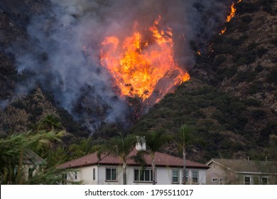 A Wildfire Burns The Hillside Behind Homes On Wednesday, Aug. 12, 2020, Azusa, California