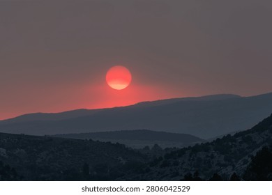 Wildfire enhanced sunset and cloudscape over Grass Valley in western Colorado on June 28, 2026.